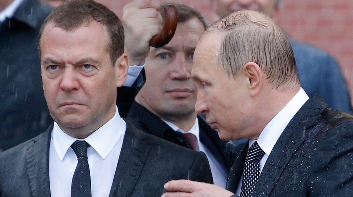 Drenched Putin and Medvedev