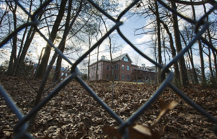 Description: A fence encloses an estate in the village of Upper Brookville in the town of Oyster Bay, on Long Island, after the Obama administration closed this compound for Russian diplomats