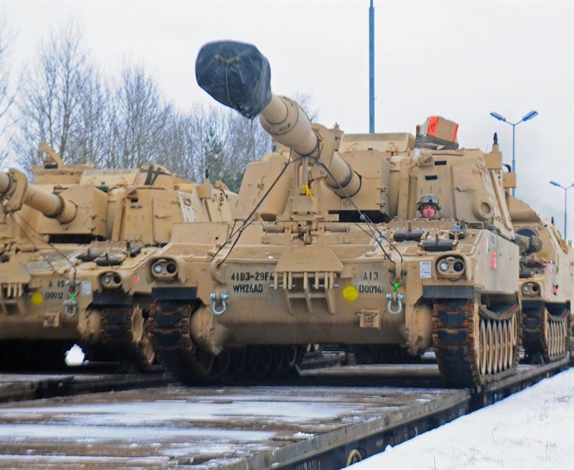 Description: An American soldier from 3rd Battalion, 29th Field Artillery Regiment, 3rd Armored Brigade Combat Team, 4th Infantry Division, drives a M109 Paladin self-propelled howitzer off of a flatcar in Drawsko Pomorskie, Poland, Jan. 9, 2017. The howitzer was one of 53 vehicles that arrived in Northeastern Poland from the Port of Bremerhaven, Germany, as part of Operation Atlantic Resolve. Rotating units through the European theater enhances U.S. European Command’s ability to deter aggression and assure U.S. allies. Army photo by Staff Sgt. Corinna Baltos